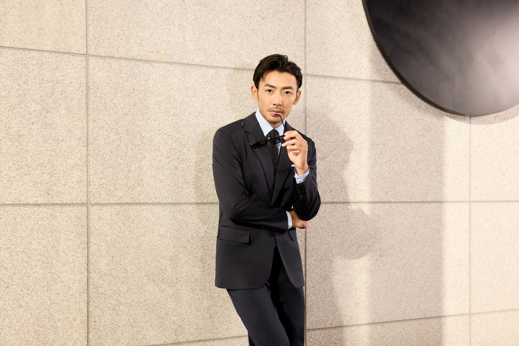 What Color Shirt to Wear With a Black Suit?
